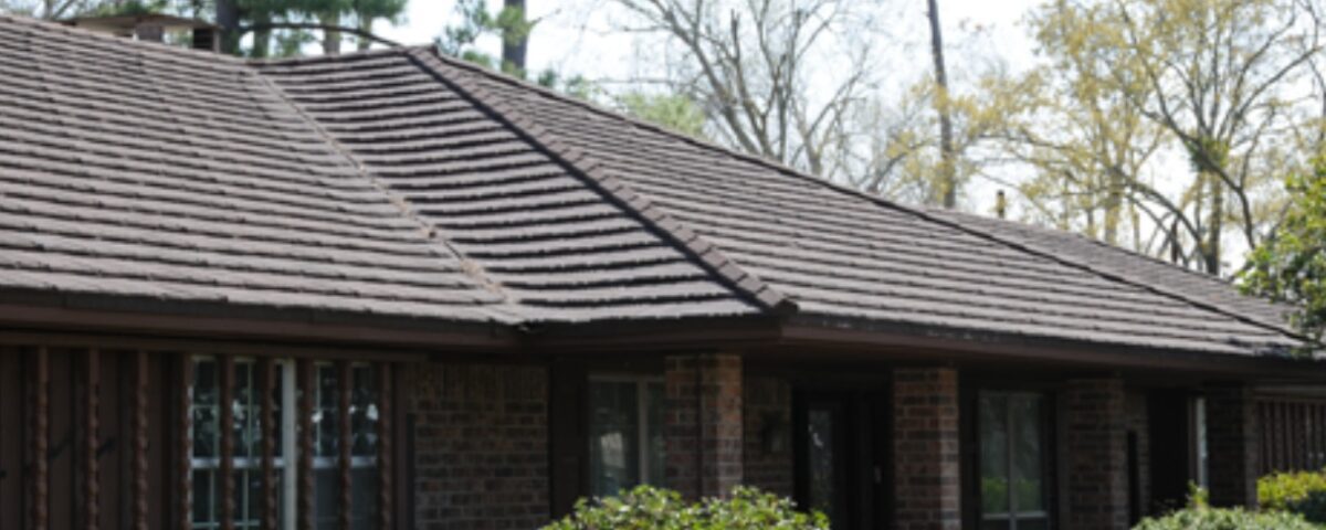 Modern brick house with a brown tiled roof and front porch in Santa Clara