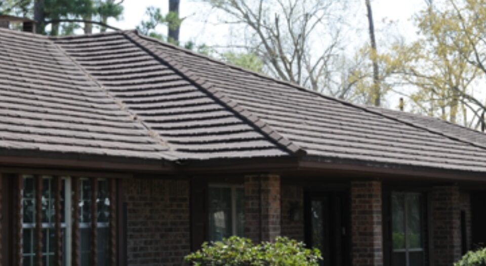 Modern brick house with a brown tiled roof and front porch in Santa Clara