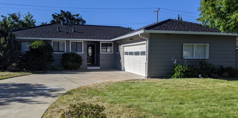 Single-story gray house with a driveway, garage, and front lawn in Santa Clara