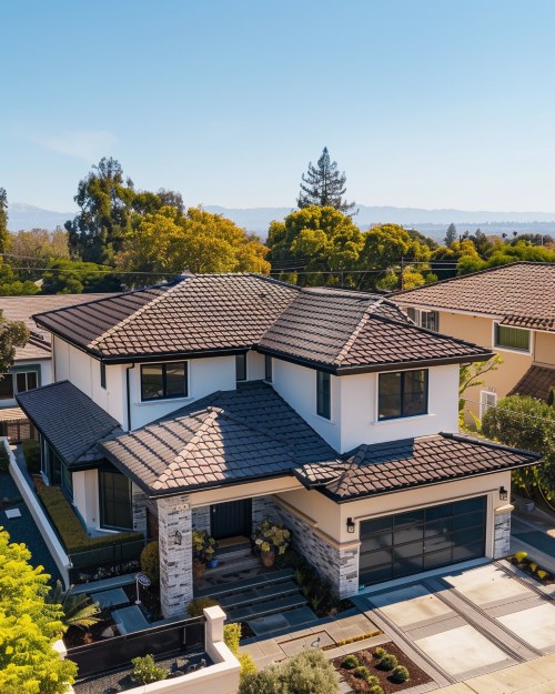 Two-story modern home featuring dark stone-coated tiles installed by a Sunnyvale, CA metal roofing specialist.