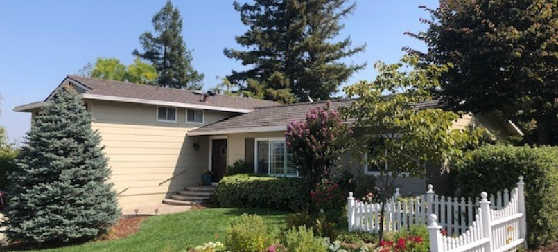 San Jose, CA roofing on a suburban home with a shingle roof and landscaped yard