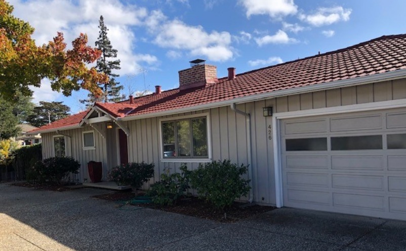 Sunnyvale, CA metal roofing contractors installing a red metal roof